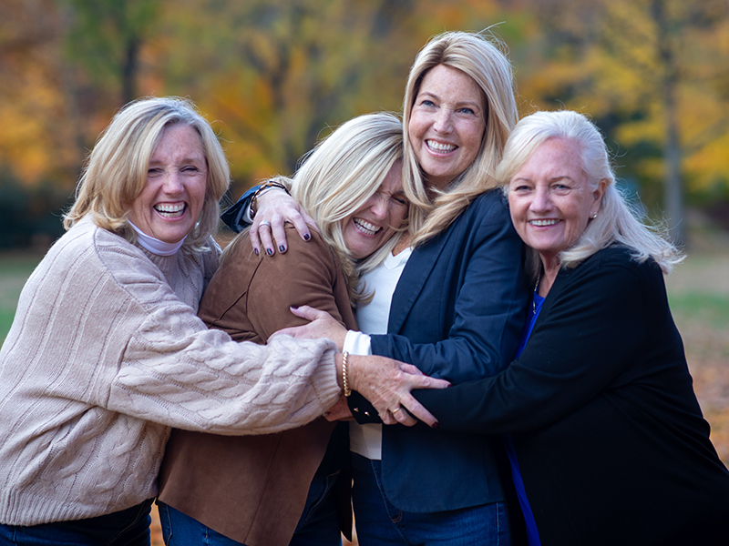 Kayellen-11-(1) Family members embracing and supporting their sister, a breast cancer survivor.